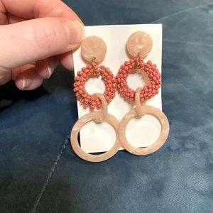Blush colored geometric dangly earrings